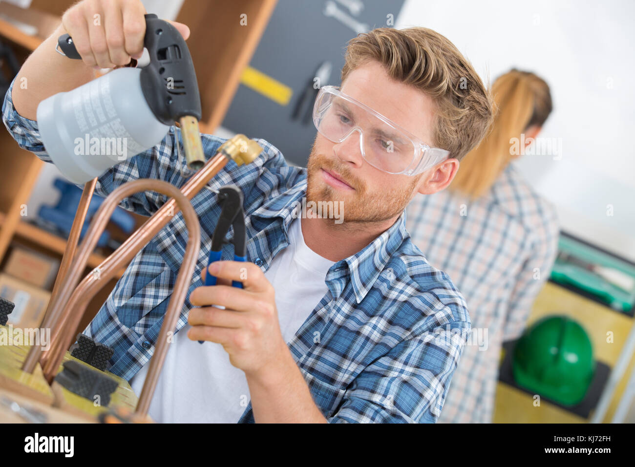 plumber soldering pipe Stock Photo Alamy