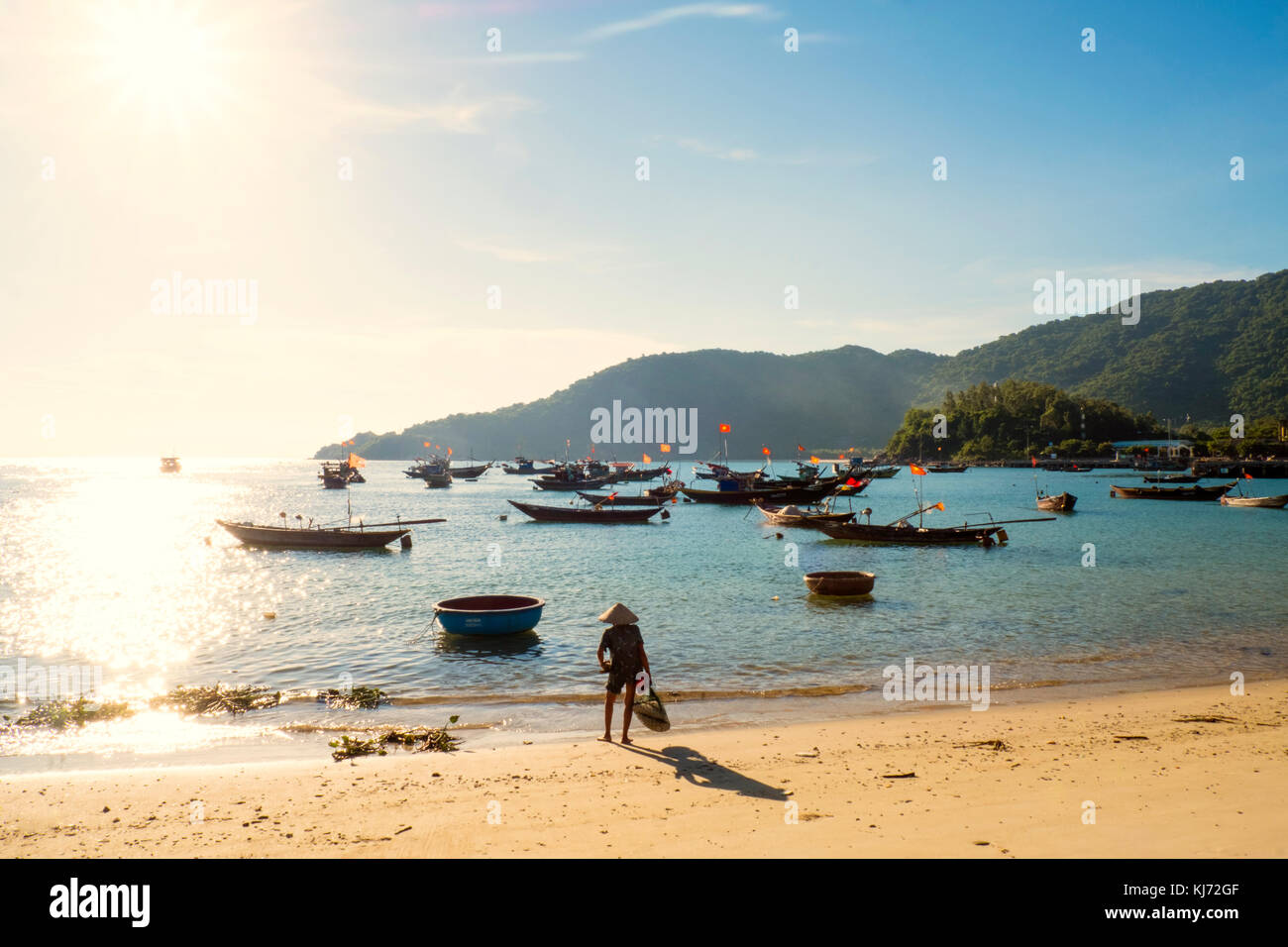 fishing boats off the beach on the Cham Islands in Vietnam Stock Photo