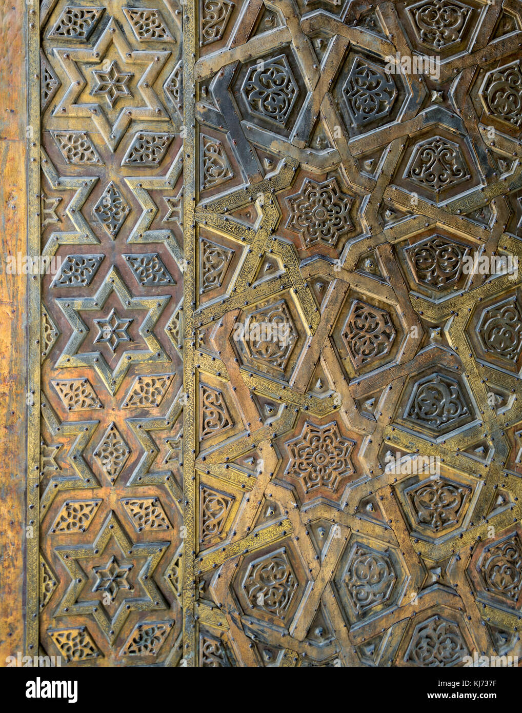 Ornaments of the bronze-plate door of Sultan Qalawun mosque, al Moez street, Old Cairo, Egypt Stock Photo