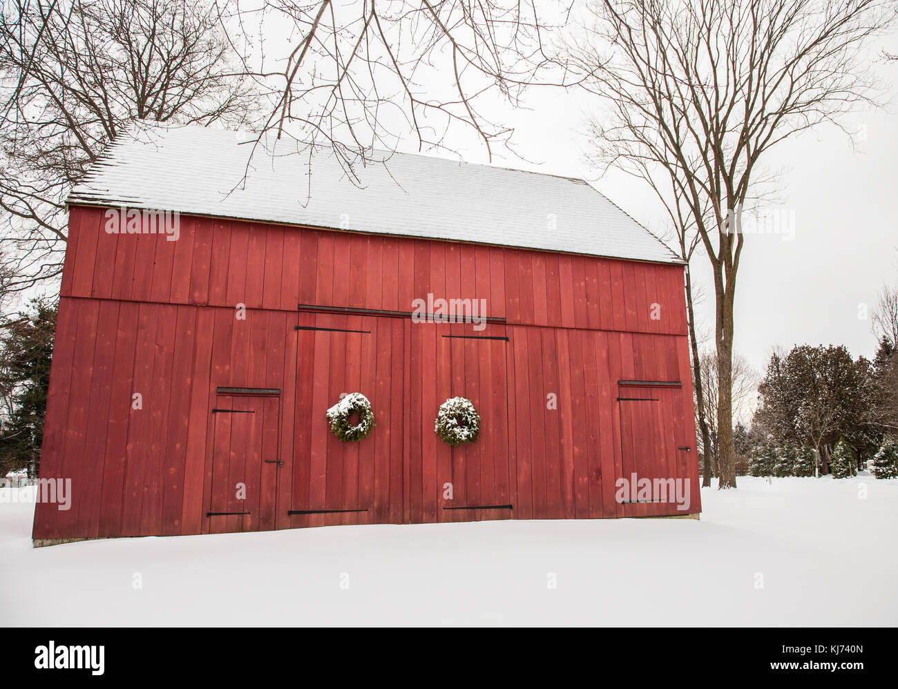 Historic red American barn in winter snow, Cranbury, New Jersey, USA