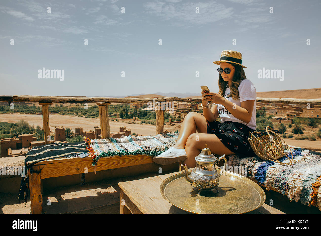 Caucasian girl texting during tea time Stock Photo Alamy