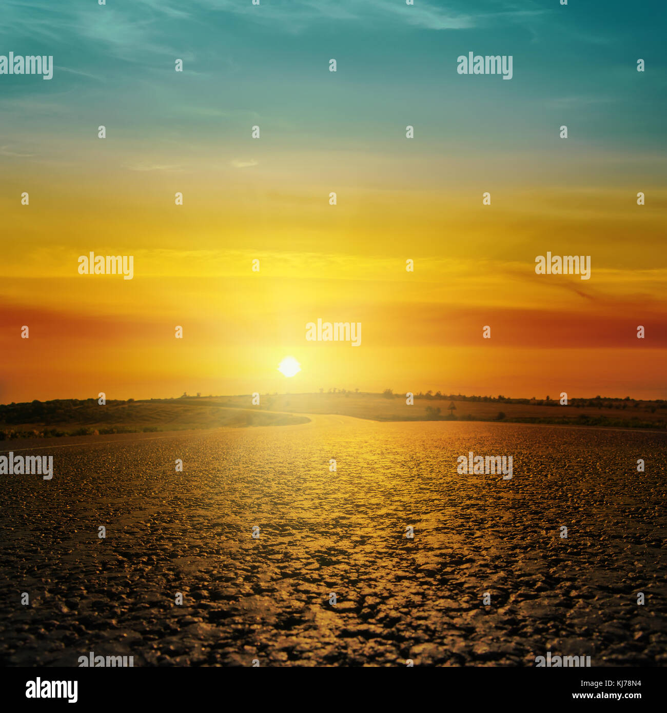 good orange sunset in clouds over asphalt road Stock Photo - Alamy
