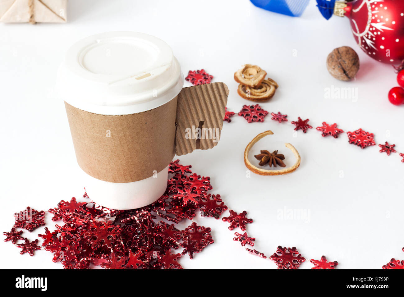 A paper cup of coffee, peppermint mocha, displayed with christmas ...