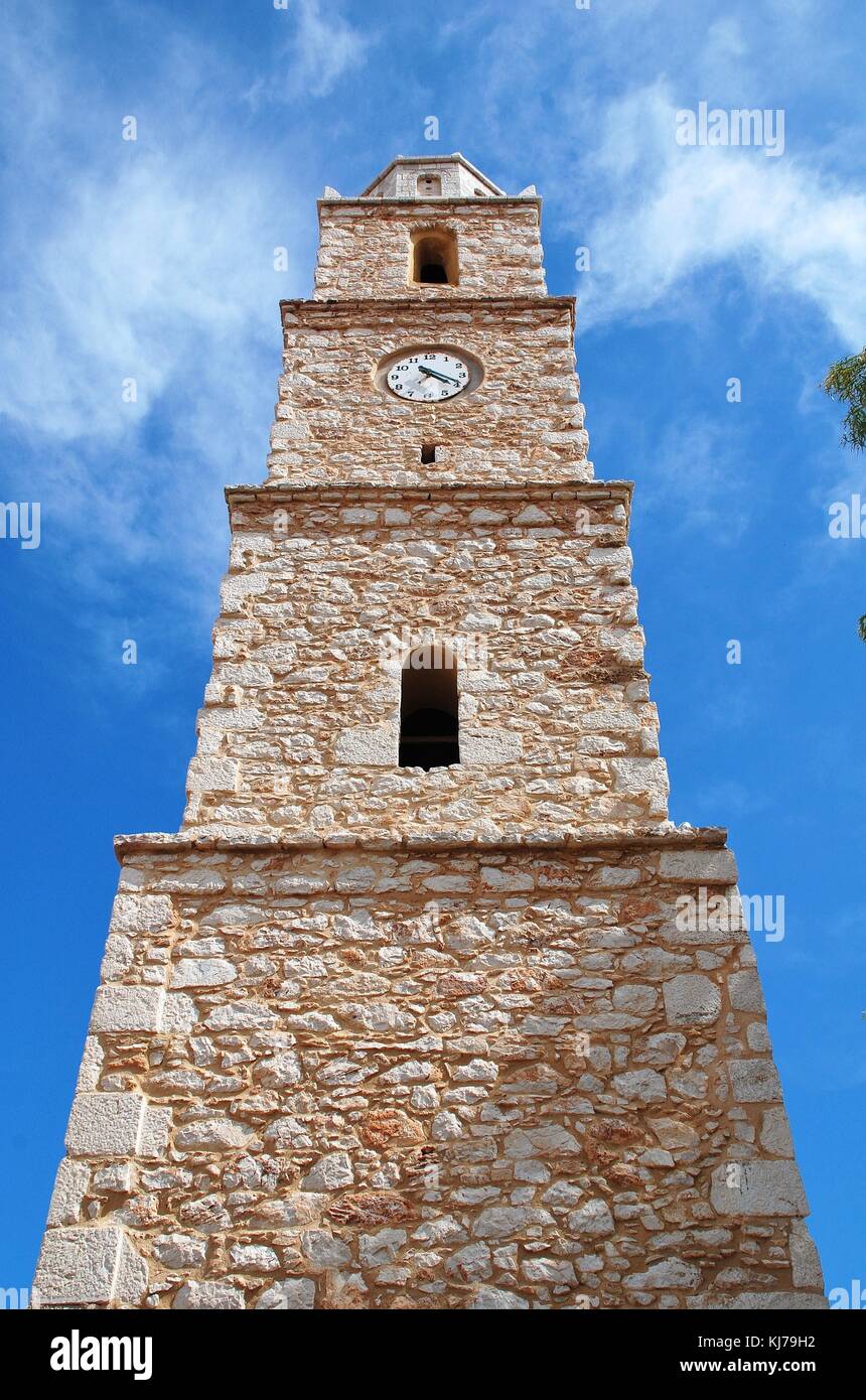 The stone clock tower at Emborio on the Greek island of Halki. The clock stopped working many years ago and is always at twenty past four. Stock Photo