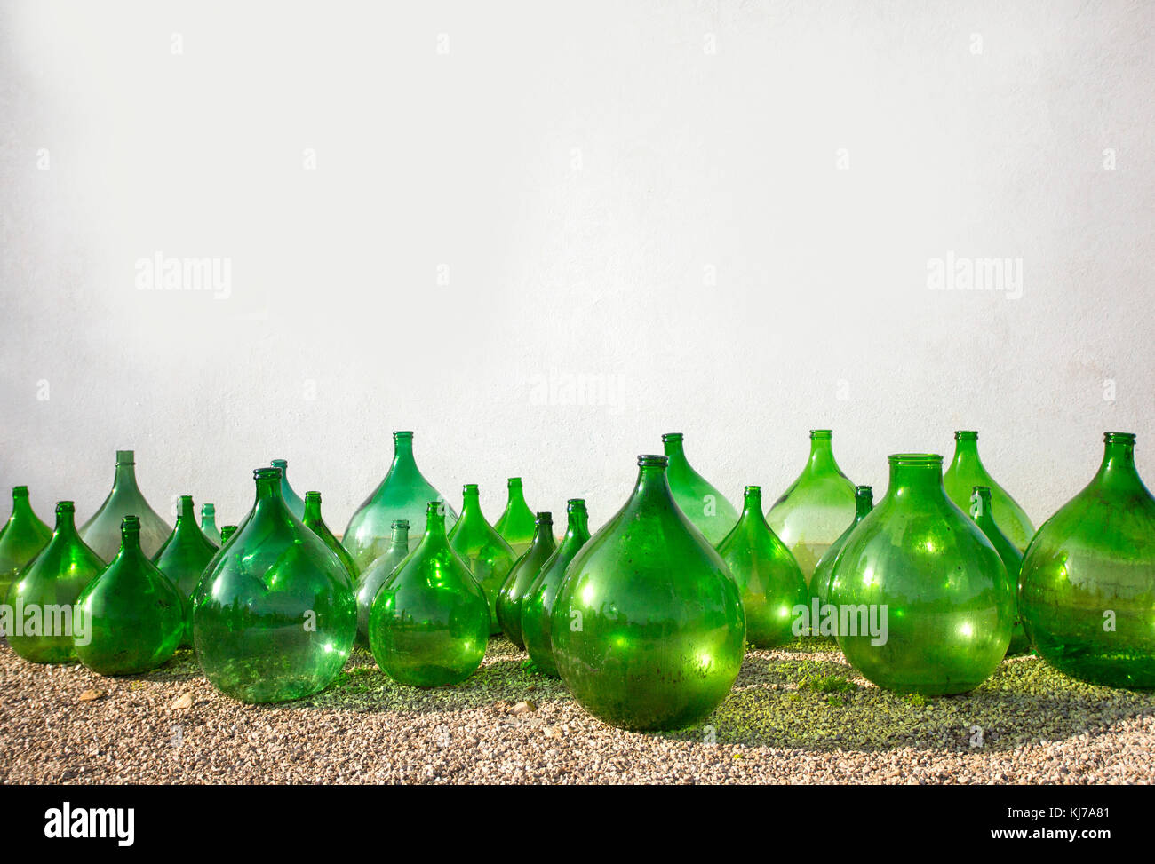 Download Old Green Bottles Of Wine Olive Oil On White Wall Stock Photo Alamy PSD Mockup Templates