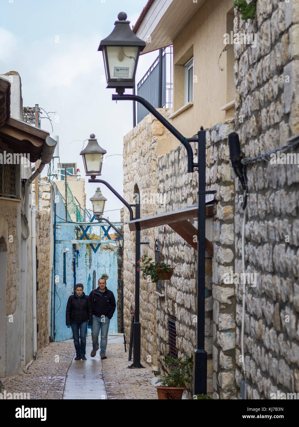 Two men walking in street, Safed, Northern District, Israel Stock Photo
