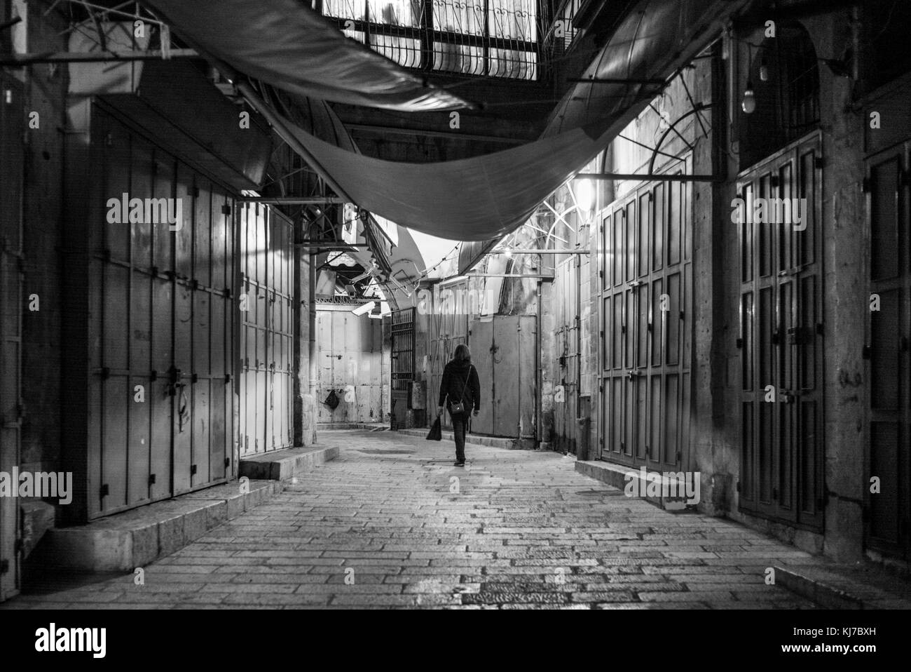 Rear view of woman walking in alley, Children Memorial, Holocaust History Museum, Yad Vashem, Jerusalem, Israel Stock Photo