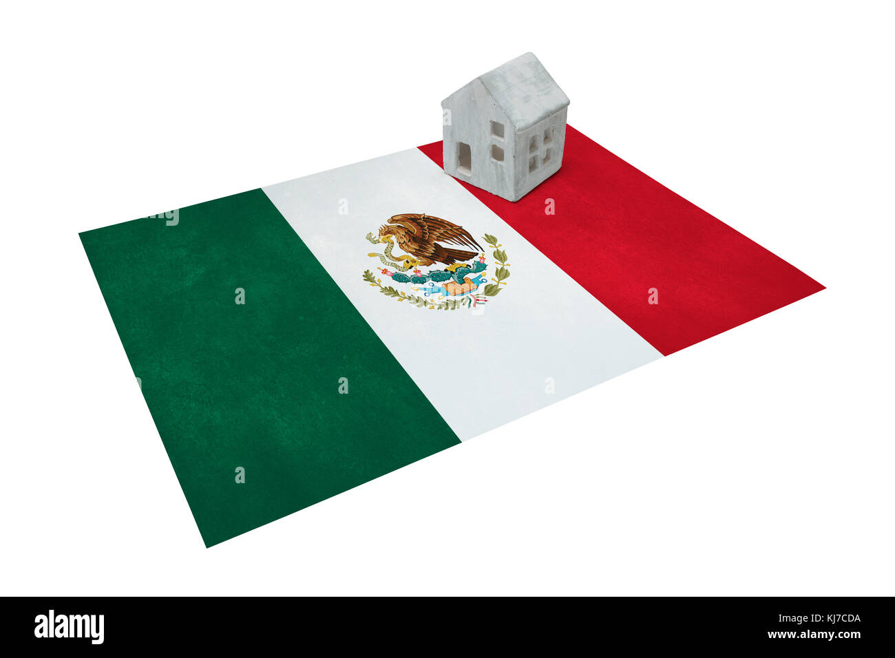 Small house on a flag - Living or migrating to Mexico Stock Photo