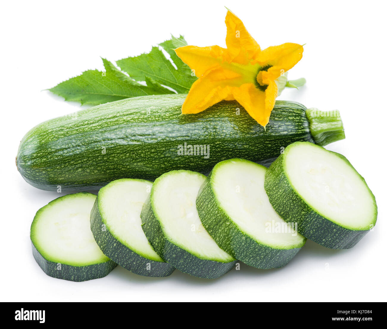 Zucchini with slices and flower on a white background. Stock Photo