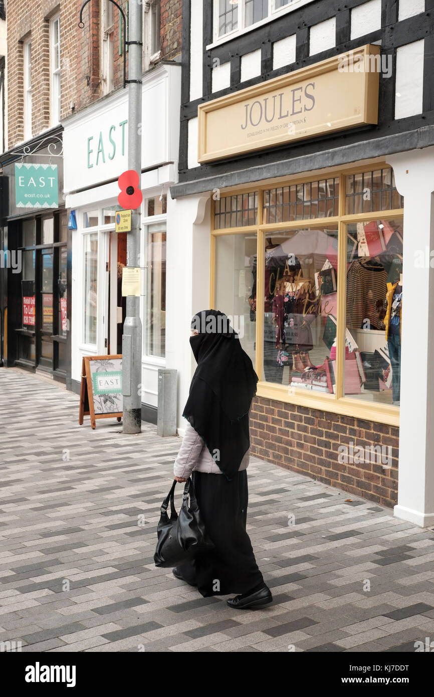 Muslim woman wearing a traditional headscarf ,London,UK Stock Photo