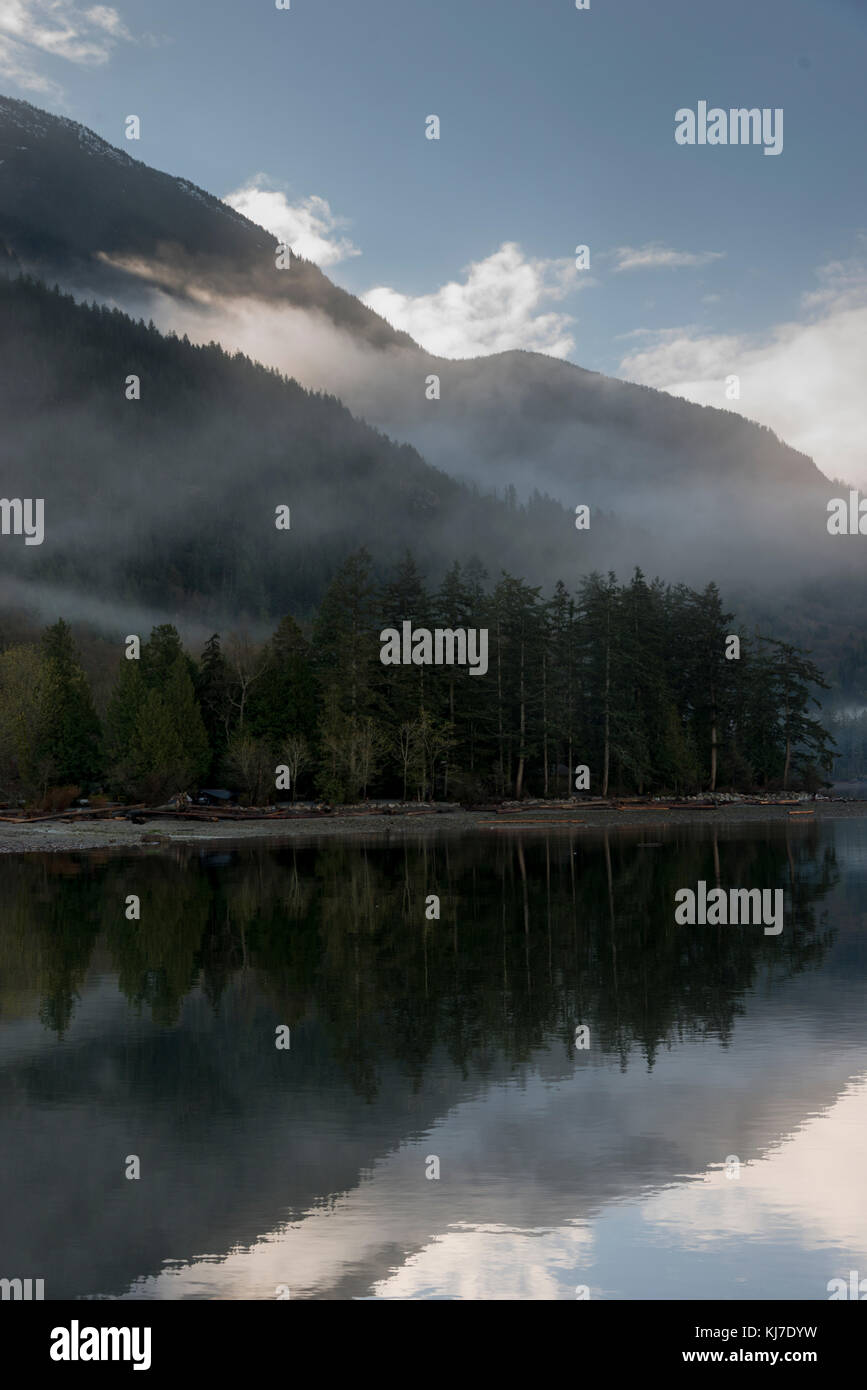 Reflection of trees in water,Furry Creek,British Columbia,Canada Stock