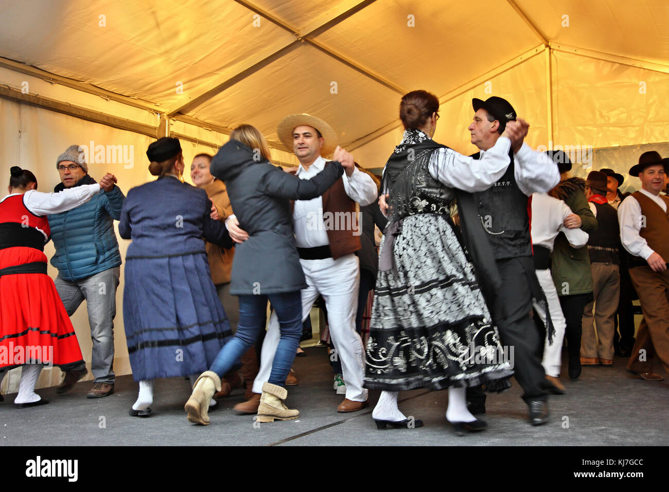 Traditional dancing in a Christmas market at the old town ("Altstadt") of Lucerne, Switzerland. Stock Photo