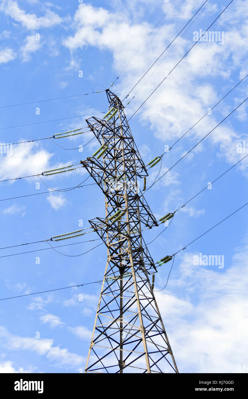 High Voltage Power Lines And Large Pylon Above Blue Sky Stock Photo - Alamy
