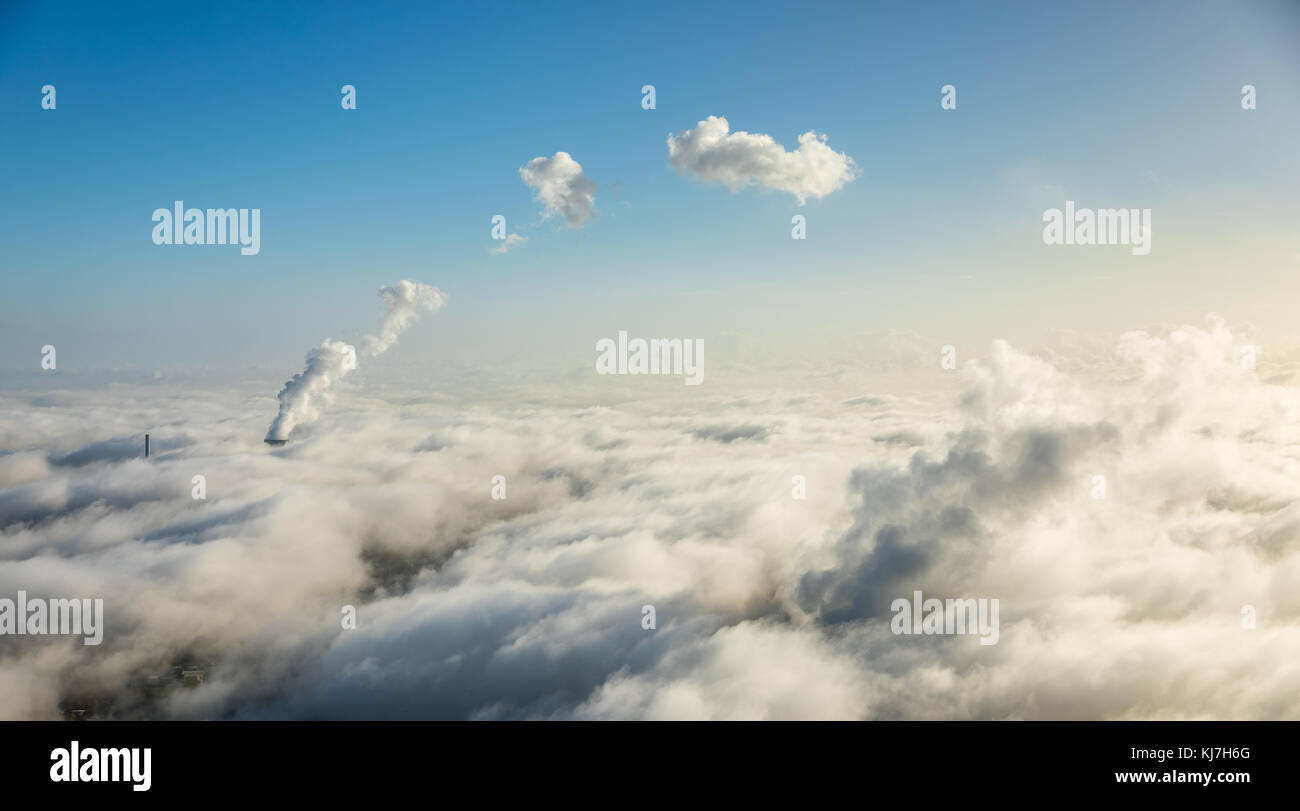 RWE Westfalen power plant, morning fog, clouds, the power plant protrudes from the low cloud cover, Hamm, Ruhr area, North Rhine-Westphalia, Germany,  Stock Photo