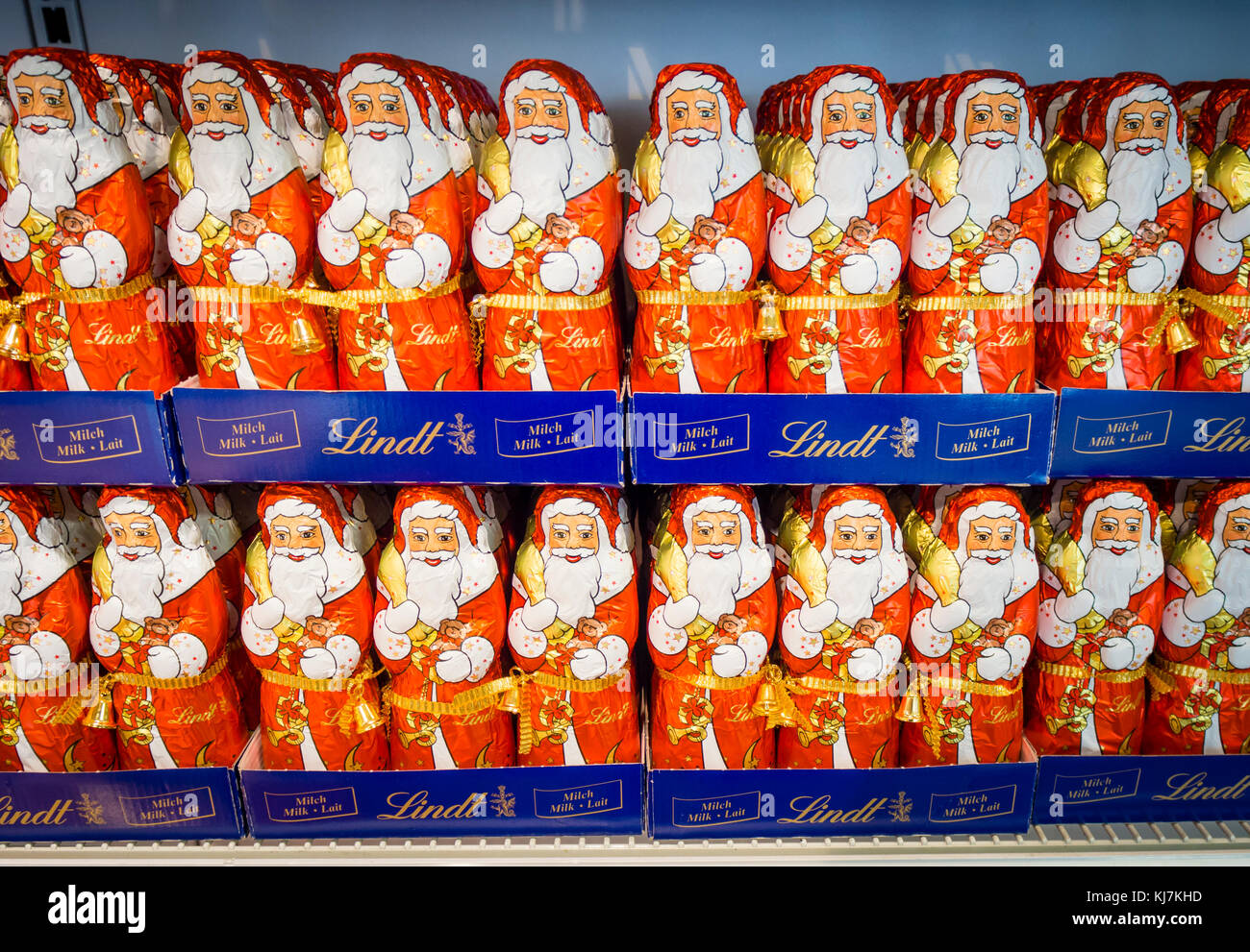 Zurich, Switzerland - 17 Nov 2017: Less than 6 weeks before Christmas, an army of chocolate Santa Clauses is lined up on a supermarket shelf. Stock Photo
