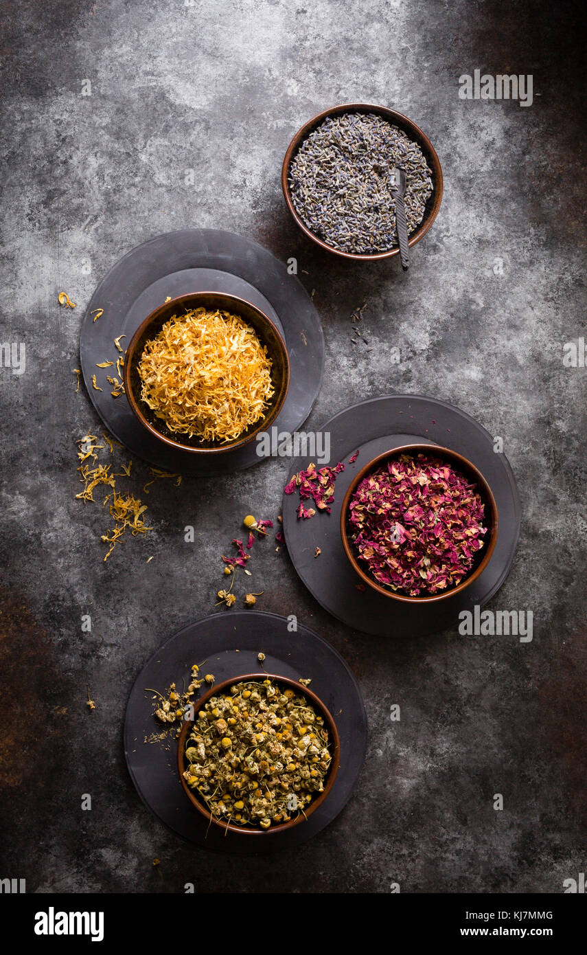 Dried flowers - Lavender,chamomile, rose and marigold on a cookie sheet background Stock Photo