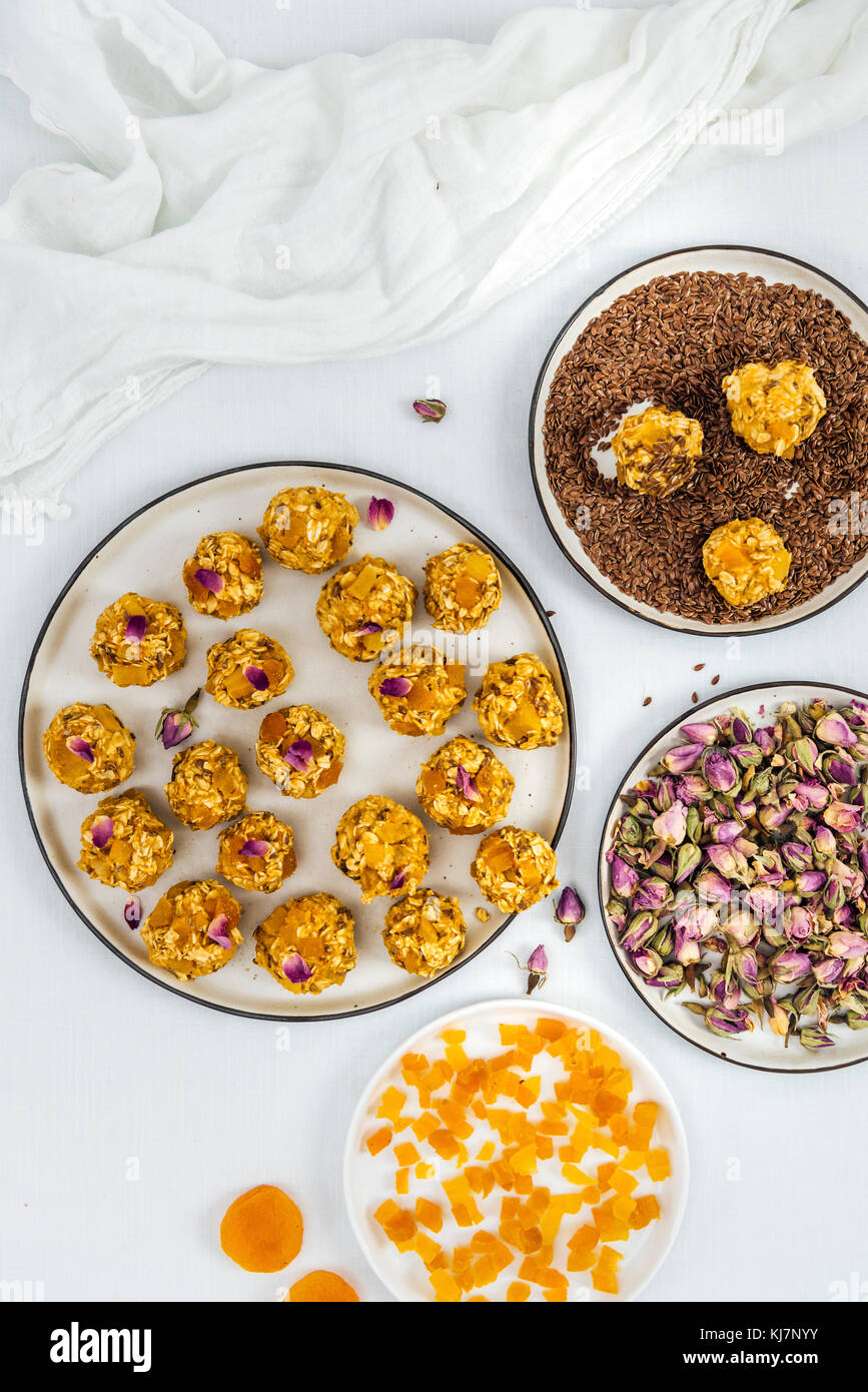 NoBake Pumpkin Energy Balls with apricots, oats and flax seeds photographed on a white