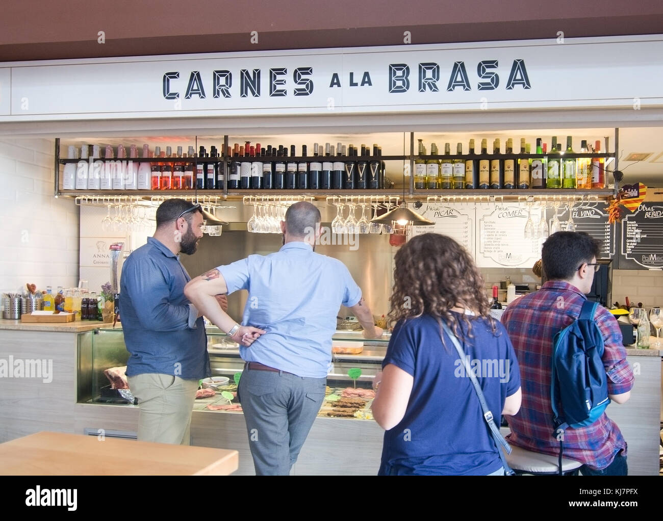 PALMA DE MALLORCA, BALEARIC ISLANDS, SPAIN - SEPTEMBER 22, 2016: Interior food court grilled meat with people in S'Escorxador and Sant Juan Market on  Stock Photo