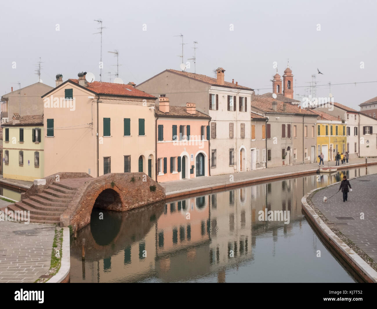 Comacchio, FE, Italy - November 4, 2017: view of one of the canals crossing Comacchio. The colored facades of the houses are reflected on the water. O Stock Photo