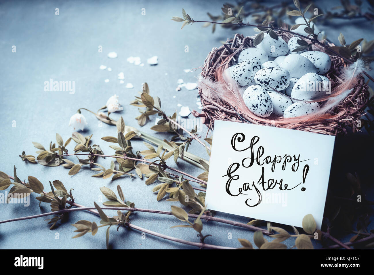 Happy Easter greeting card with lettering, nest with bird eggs and ...