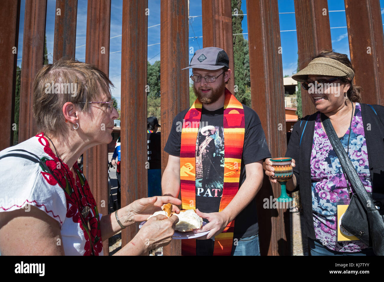 Nogales, Arizona USA and Nogales, Sonora Mexico - 11 November 2017 - Sister Luch Nigh (left) of the School Sisters of Notre Dame accepts communion at  Stock Photo