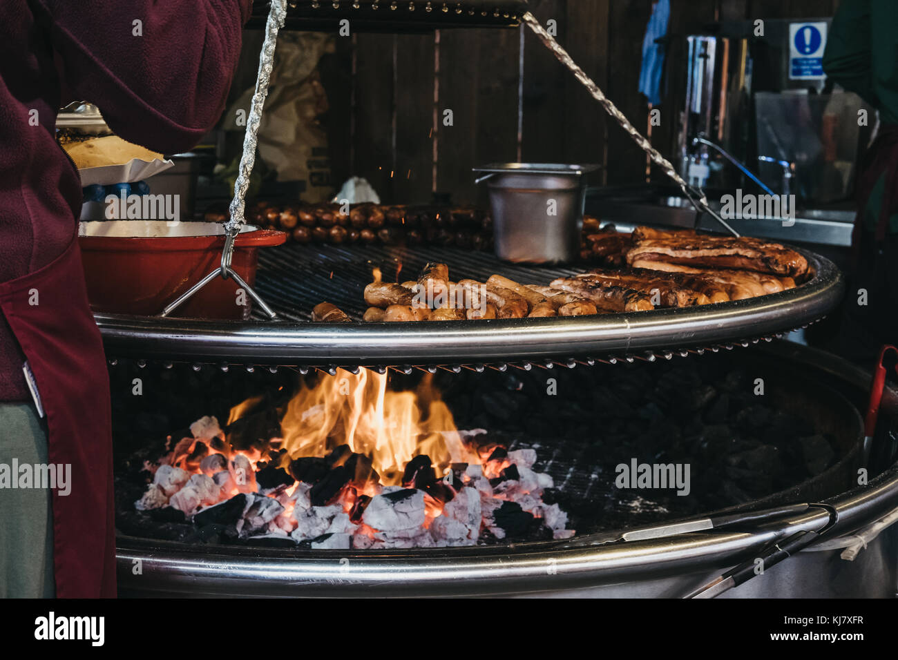 German sausages cooked on an outdoor grill at a festival Stock Photo