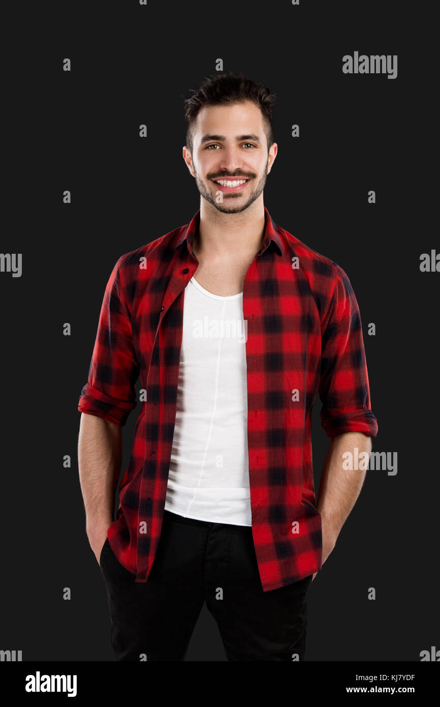 Portrait of a handsome young man, isolated over a gray background Stock ...