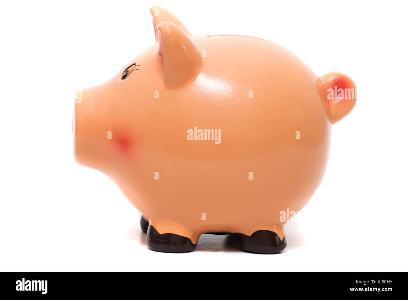 Close up view of a cute pink piggy bank isolated on a white background ...