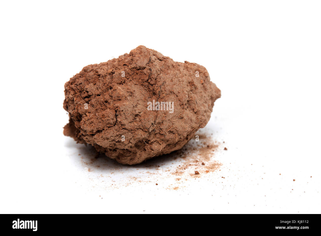 red chunk of barren clay isolated on a white background Stock Photo - Alamy