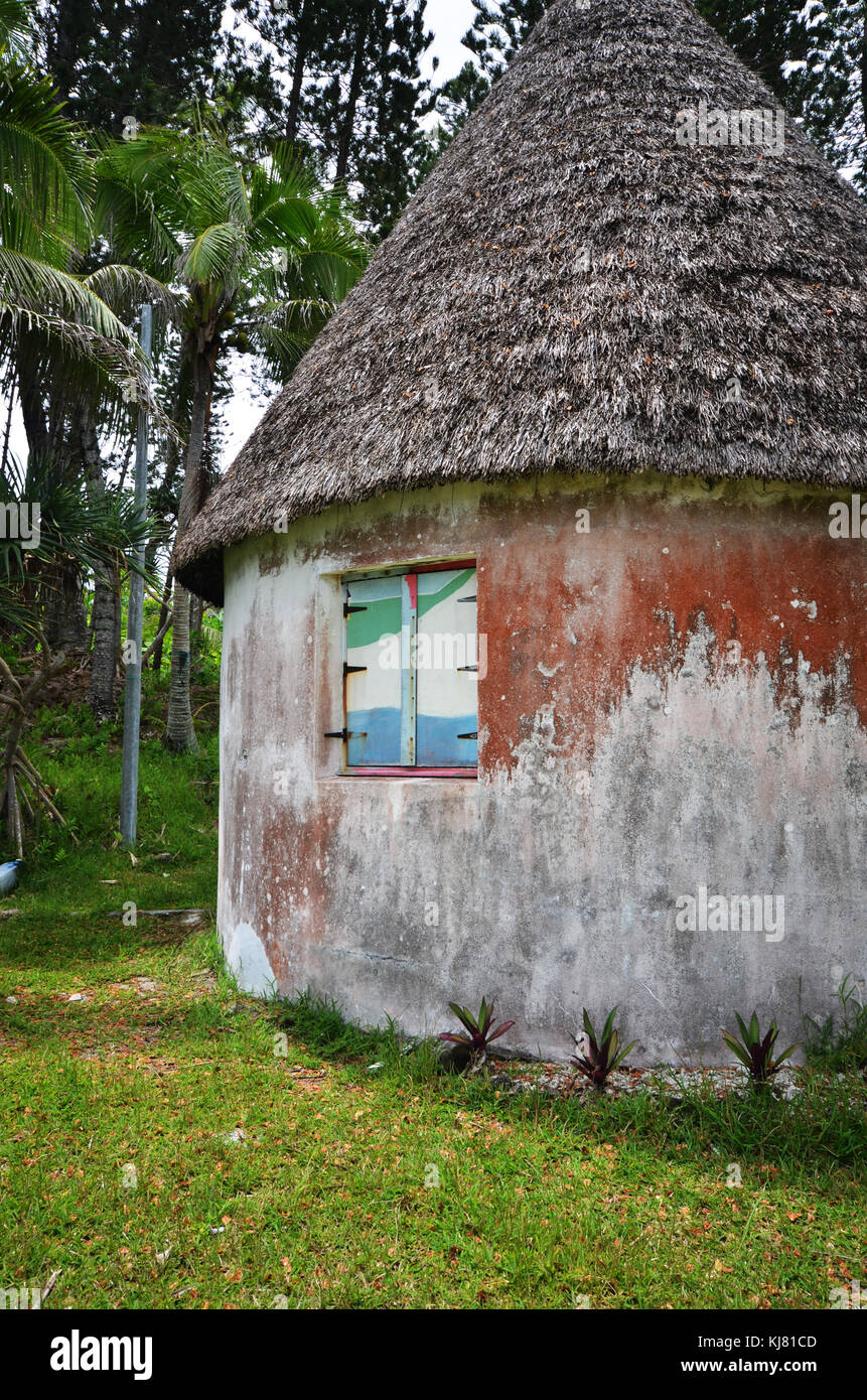 Stone hut with thatched roof in Mare one of the loyalty islands New Caledonia Stock Photo