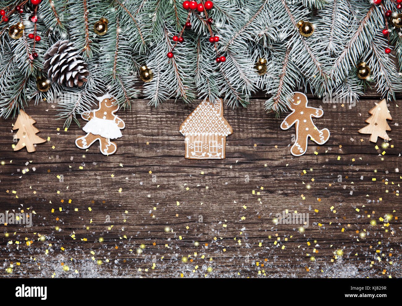 Christmas fir tree with decoration on dark wooden background Stock Photo