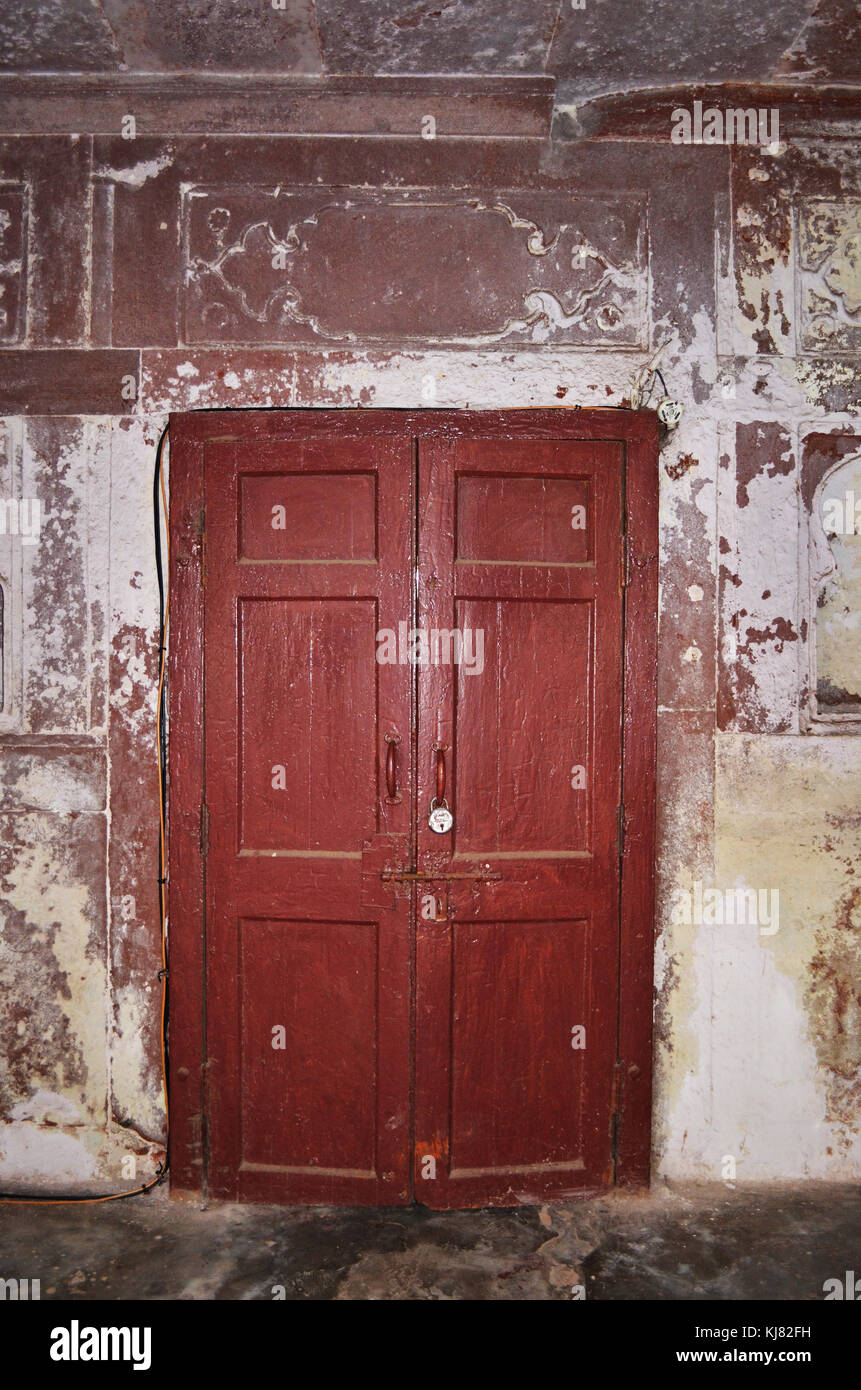 Wooden door in stone doorway captured in New Delhi India Stock Photo