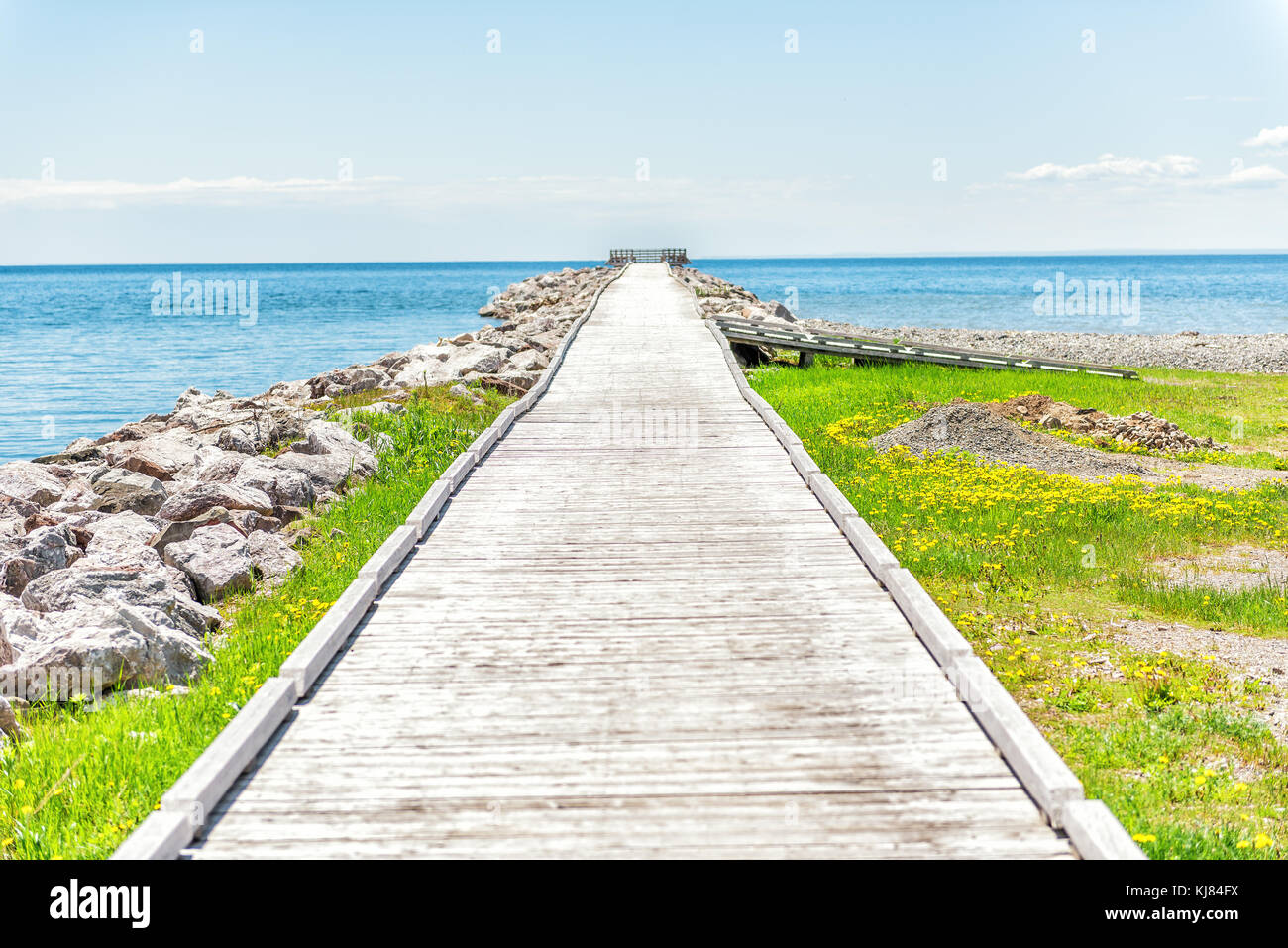Empty Long Wooden Boardwalk With Nobody On Pier Dock Quay With Gulf Of Saint Lawrence River In Gaspesie Region Of Quebec Canada With Converging Lines Stock Photo Alamy