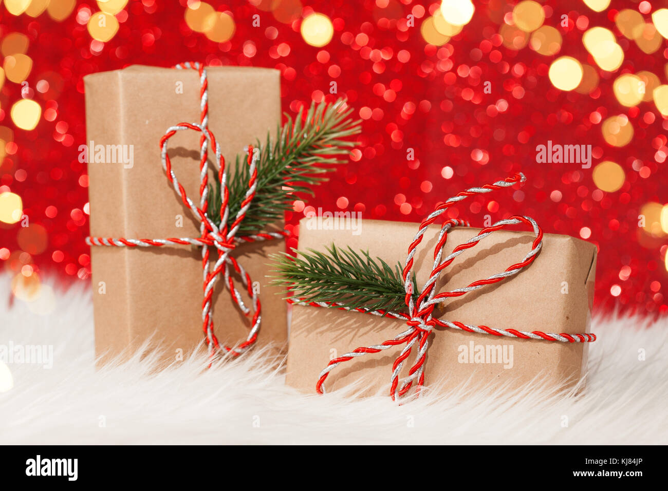Two gift boxes wrapped with ribbon on red background Stock Photo Alamy
