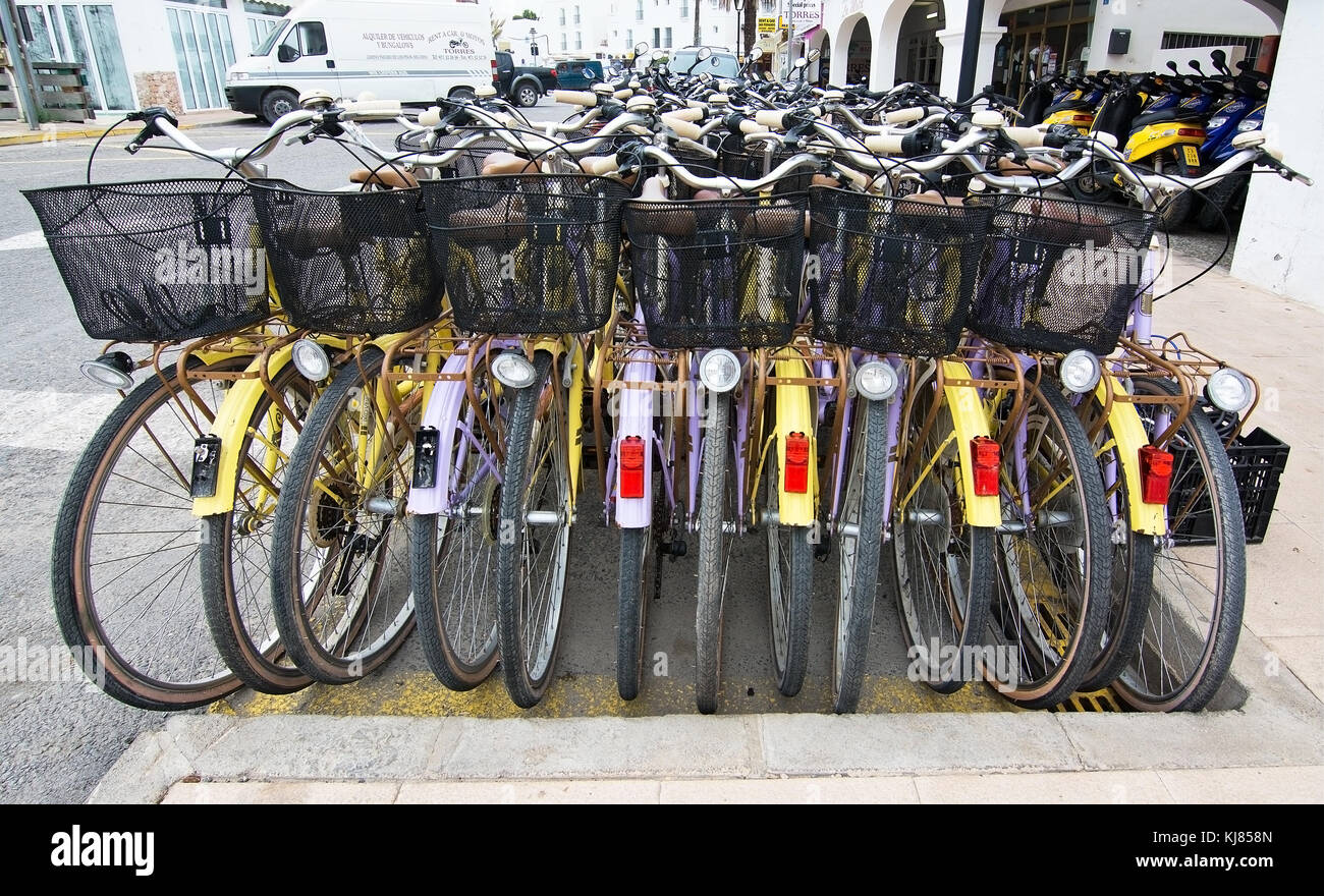 FORMENTERA, BALEARIC ISLANDS, SPAIN - OCTOBER 25, 2016:  Colorful rental bicycles packed together on October 25, 2016 in Formentera, Balearic islands, Stock Photo