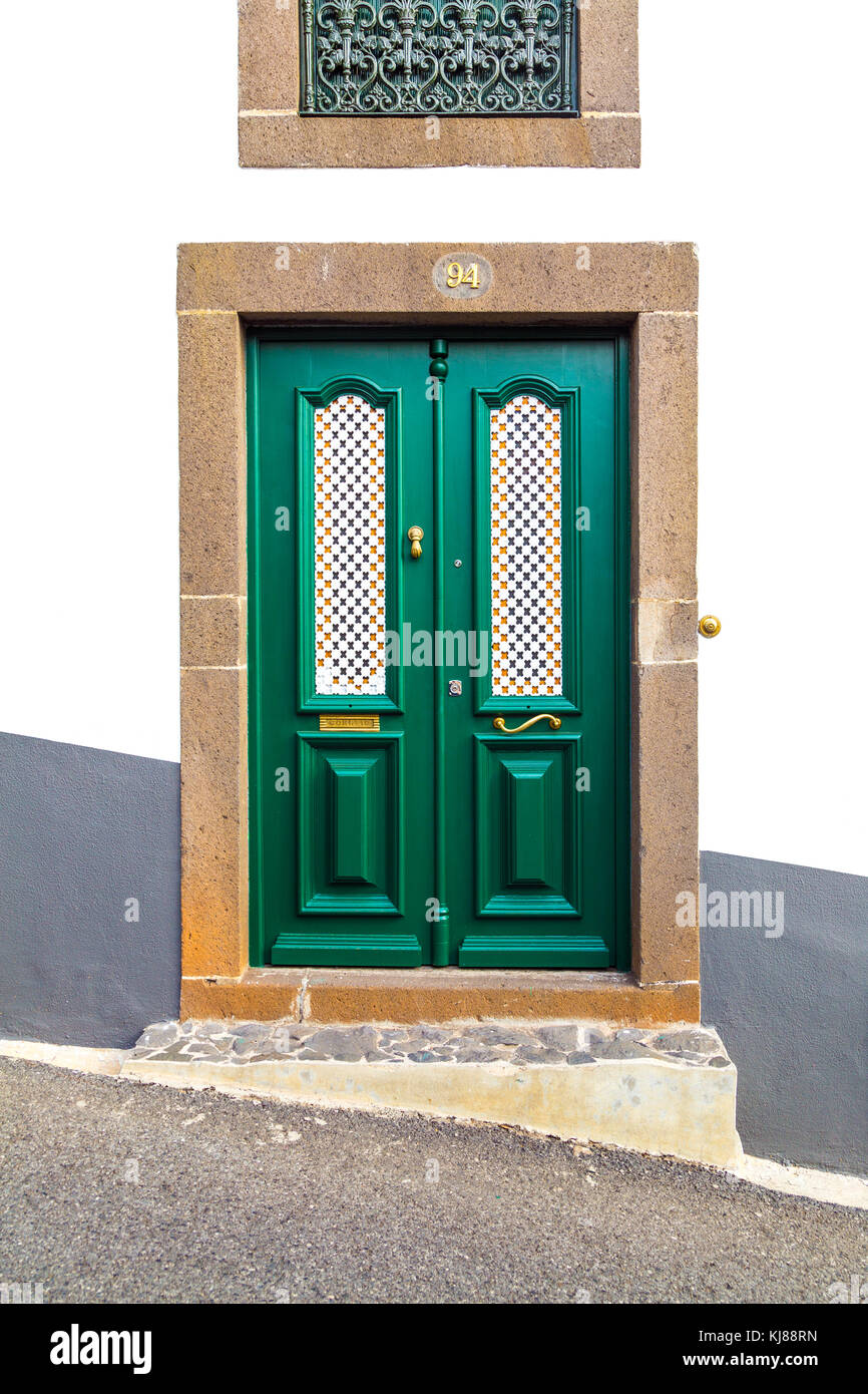 A unique decorative green door to a house on a sloped street in Funchal, Madeira, Portugal Stock Photo