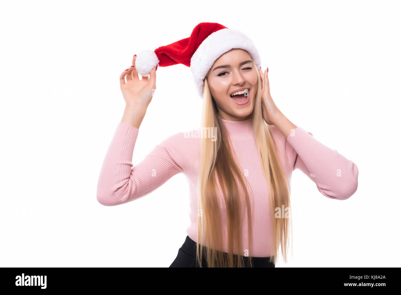 Portrait of joyful pretty woman in red santa claus hat laughing ...