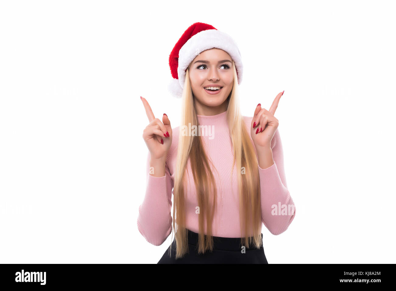 Portrait of joyful pretty woman in red santa claus hat laughing ...