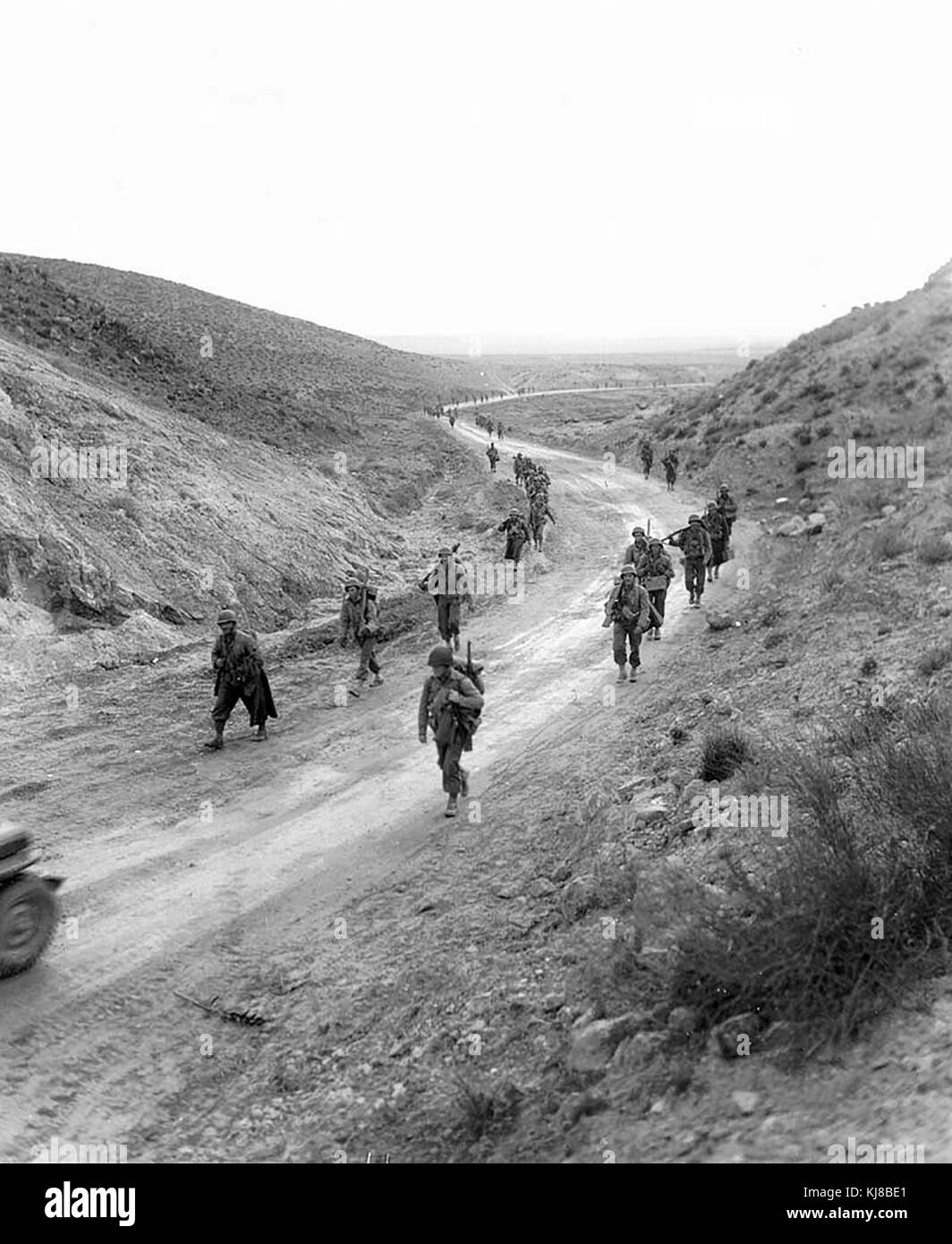 2nd Battalion, 16th Infantry clearing the way and clearing mines, walking through the Kasserine Pass, Tunisia. 26 Feb 1943. World War II Stock Photo