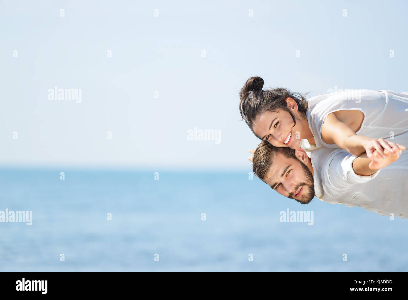 A picture of a happy couple having fun at the beach Stock Photo