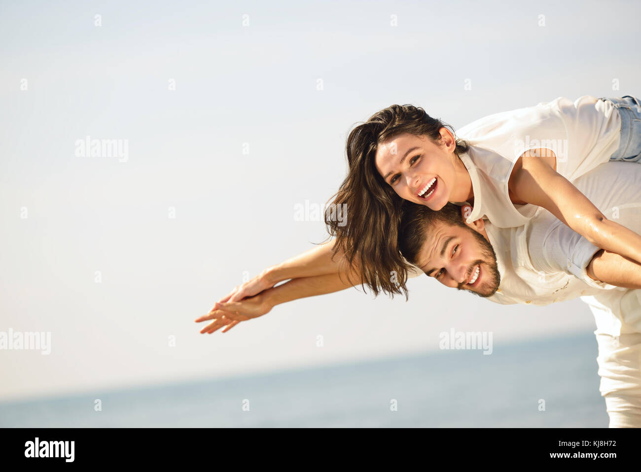 A picture of a happy couple having fun at the beach Stock Photo
