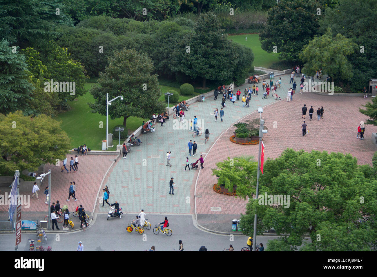 People walk through People's Square Park in central Shanghai, China. Stock Photo