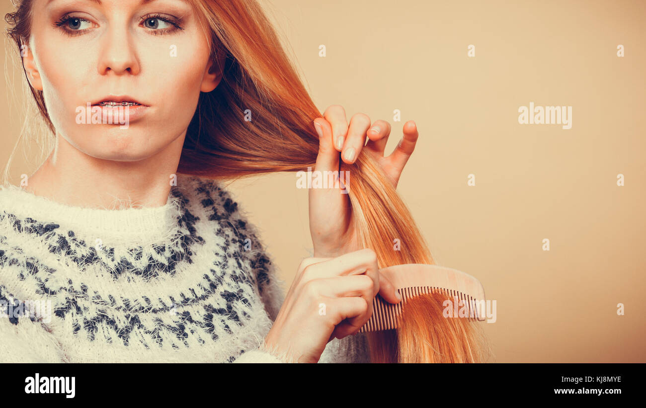 Haircare, choosing best conditioner for tangled hairstyle concept. Teenage blonde girl brushing