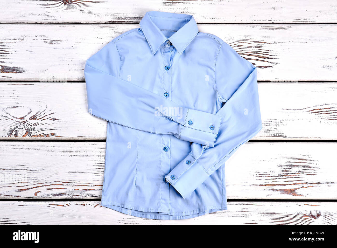 Light Blue Shirt With Long Sleeves Formal Shirt On Wooden Background