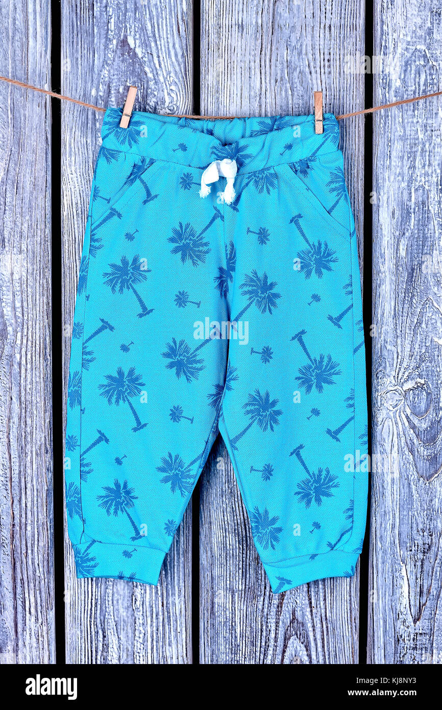 Kids printed trousers on rope. Childs blue patterned harem pants