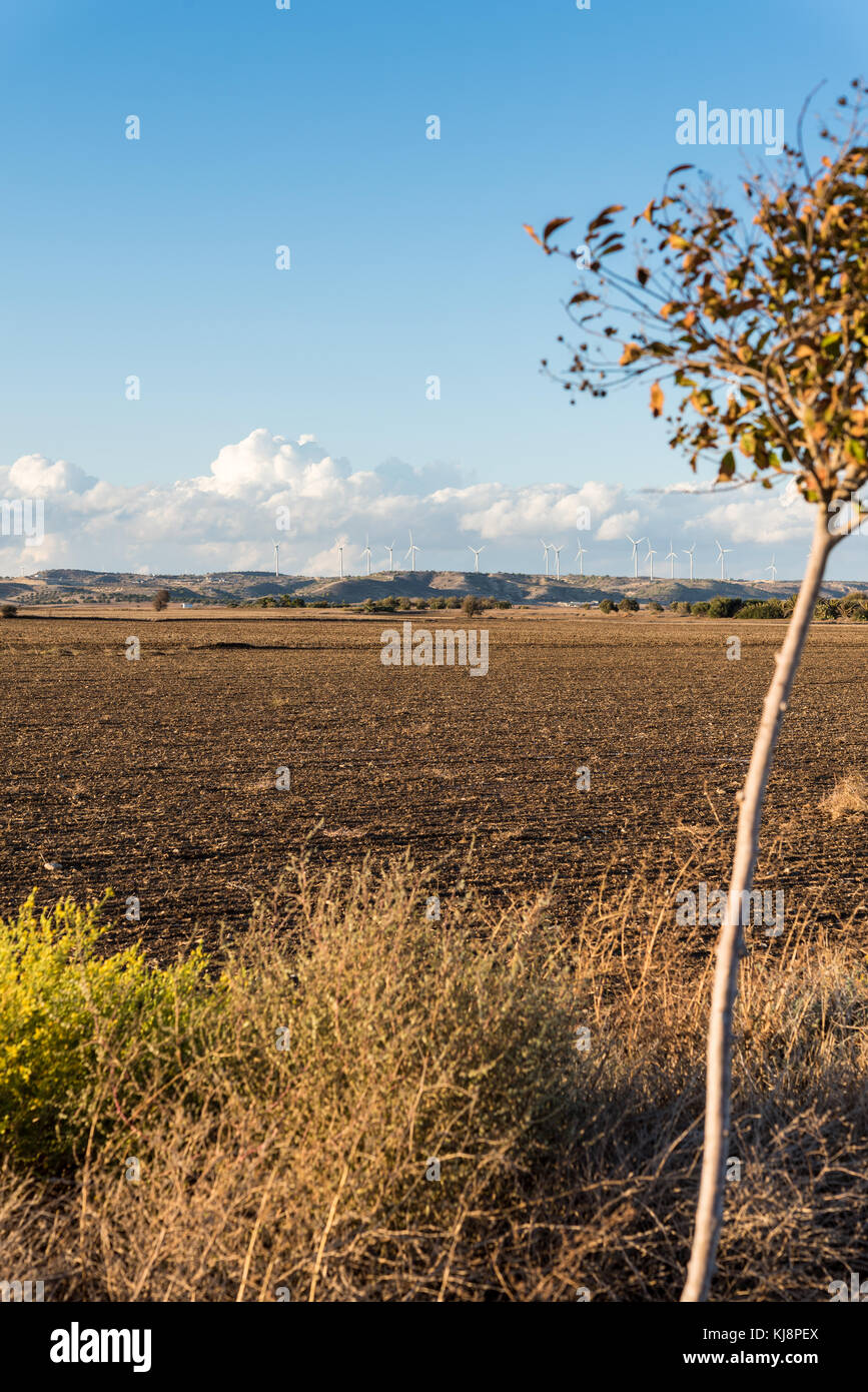 Agricultural land and wind turbines on a hill - cloudy day Stock Photo ...