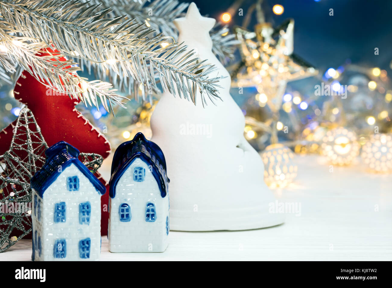 christmas souvenirs, decorations, fir tree branch on blurred blue ...