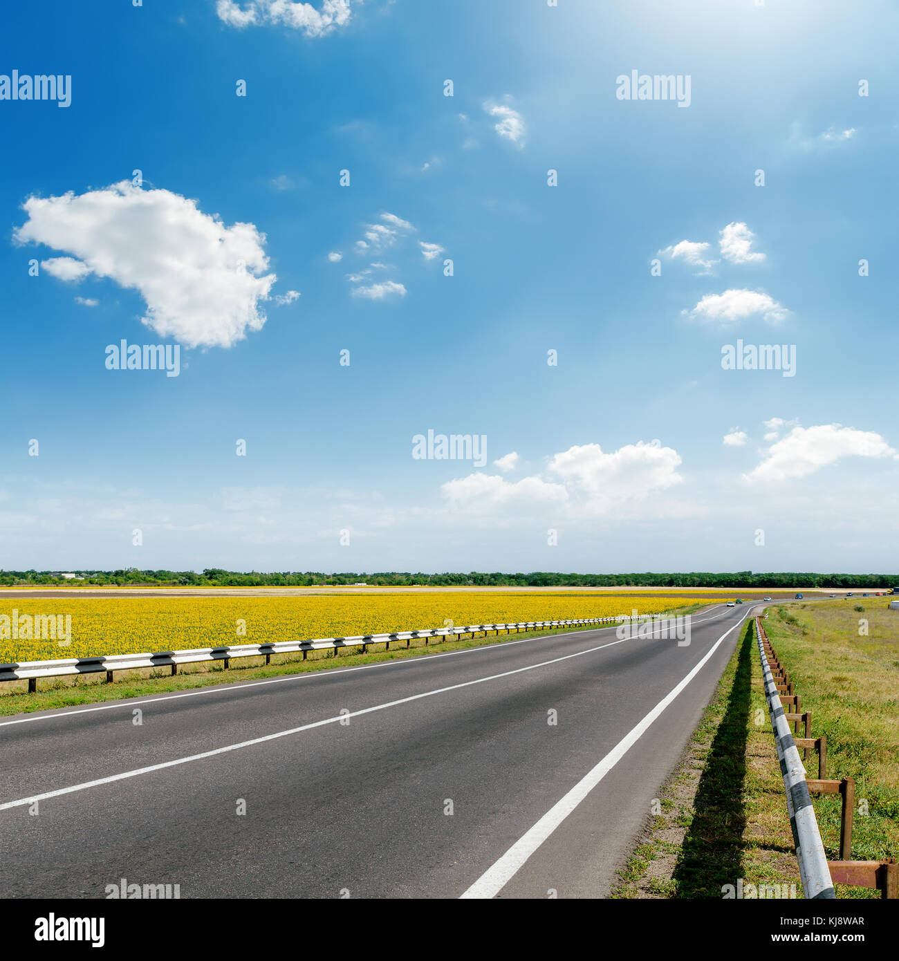 asphalt road and blue sky with clouds Stock Photo - Alamy