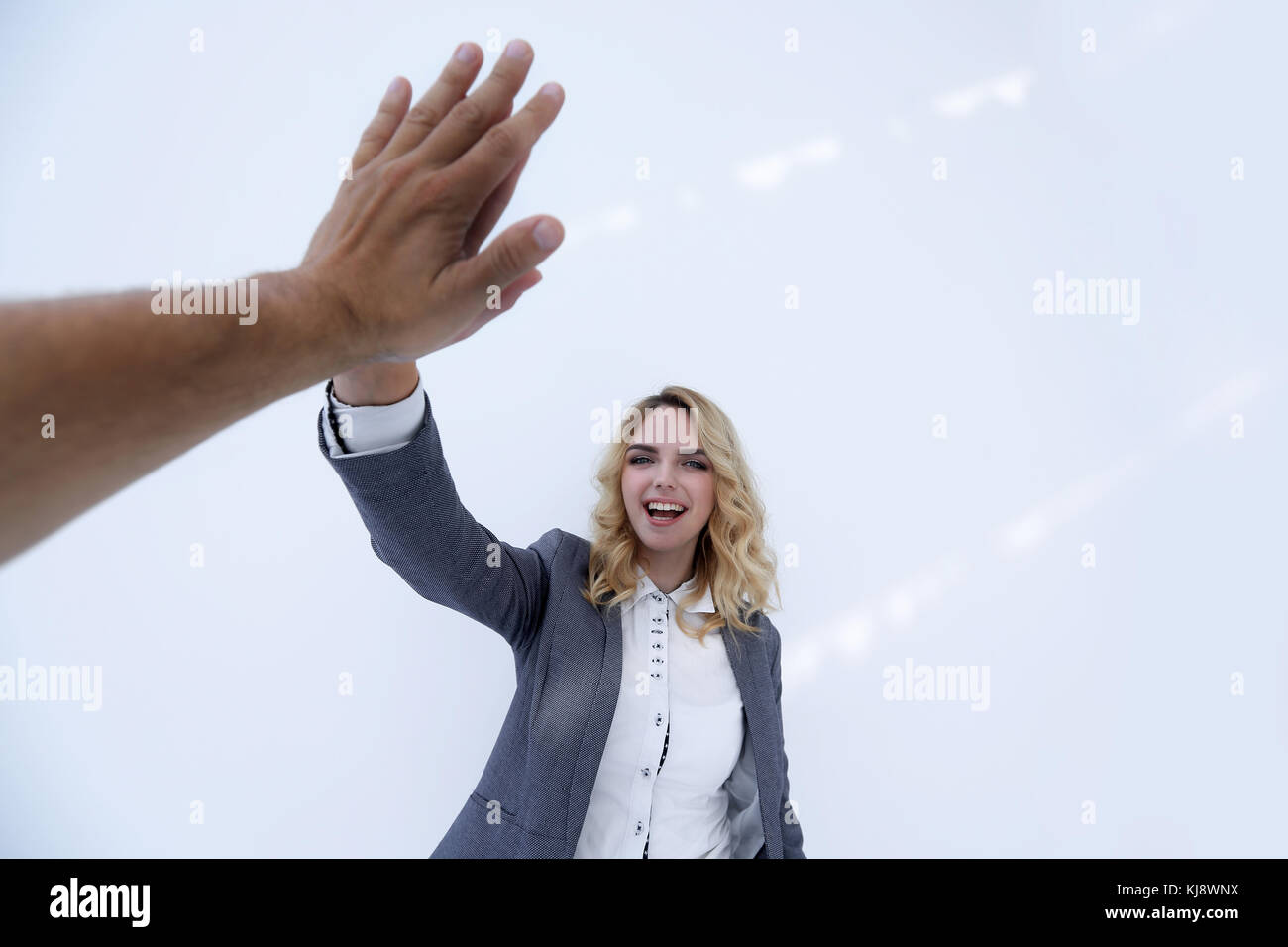 successful business woman giving a high five Stock Photo - Alamy