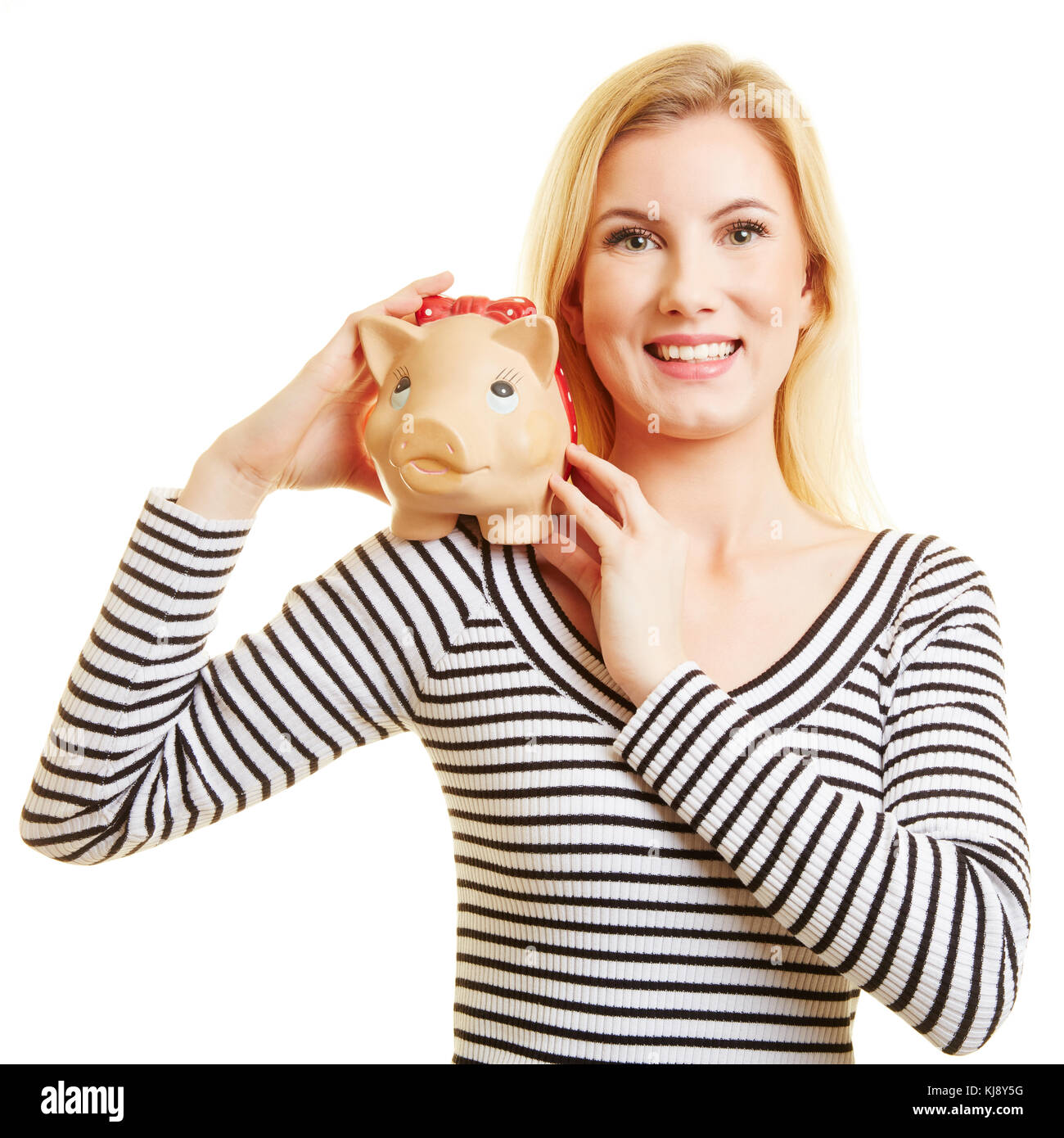 Young blond woman holds piggy bank in her hands Stock Photo - Alamy